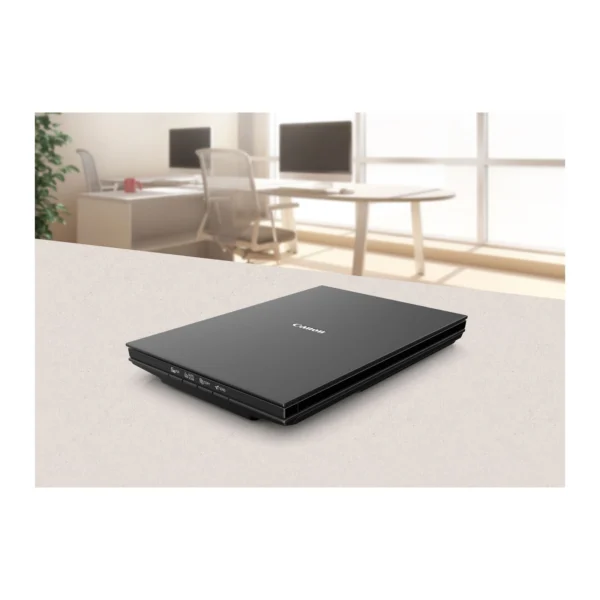 canon-lide-300-main Canon CanoScan LiDE 300 slim flatbed scanner in matte black resting flat on an office desk.