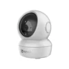EZVIZ H6c 1080p smart Wi-Fi camera sitting upright on a tabletop showing its pan-tilt sphere lens.